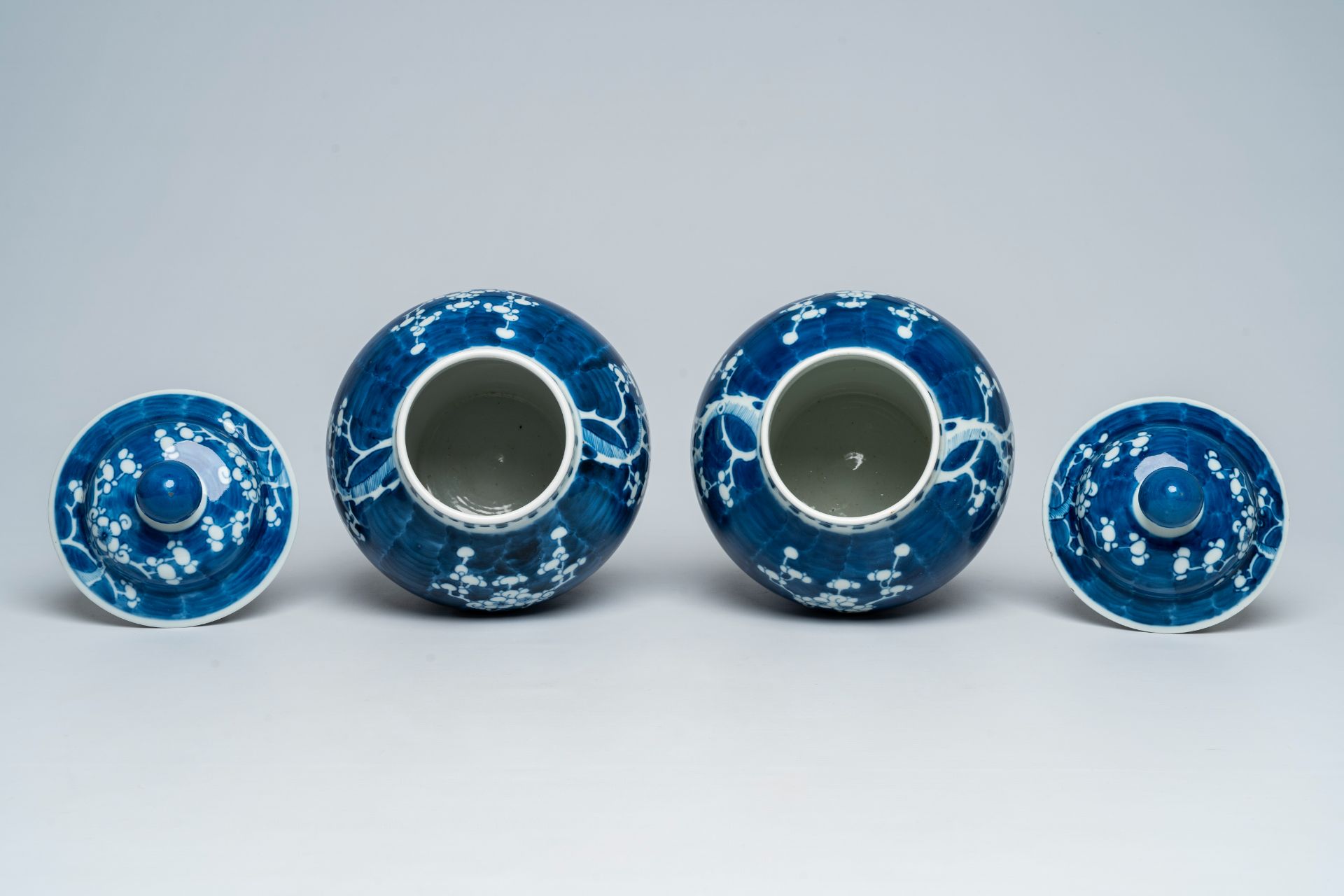 A pair of Chinese blue and white prunus on cracked ice ground vases and covers, 19th C. - Image 5 of 6