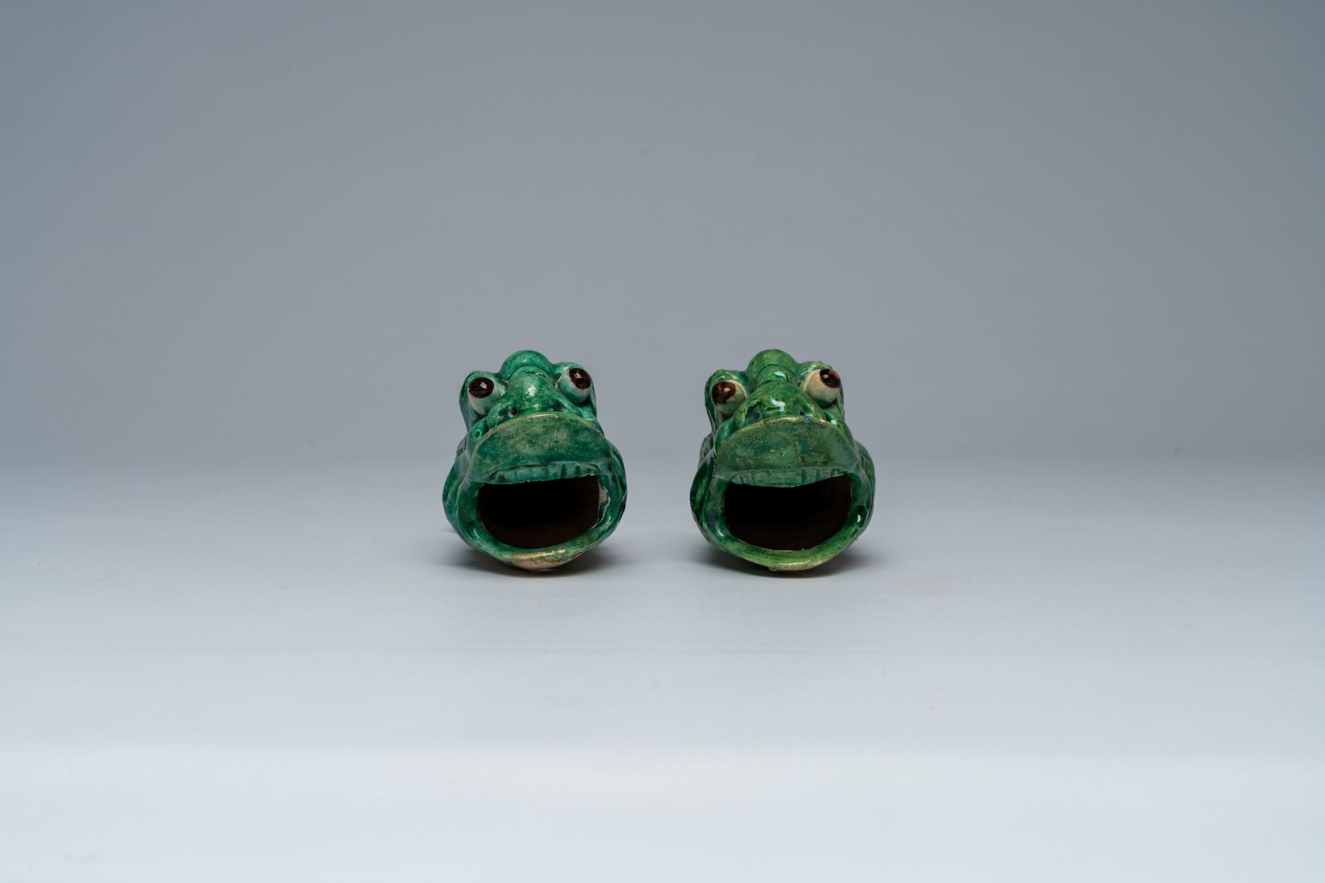 A pair of Chinese green glazed earthenware 'carp' wall vases, ca. 1900 - Image 3 of 7