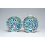 A pair of clobbered Chinese blue and white 'Eight Immortals' plates, Xuande mark, 19th C.