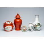 A varied collection of Chinese polychrome porcelain comprising two jars and covers and three vases,