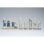 Eight Chinese blue, white and celadon glazed figures, Qianlong