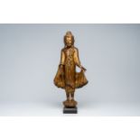 A Thai inlaid gilt wood figure of a standing Buddha, 20th C.