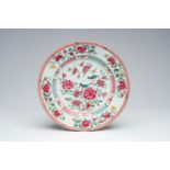 A large Chinese famille rose plate with birds among blossoming branches, Yongzheng