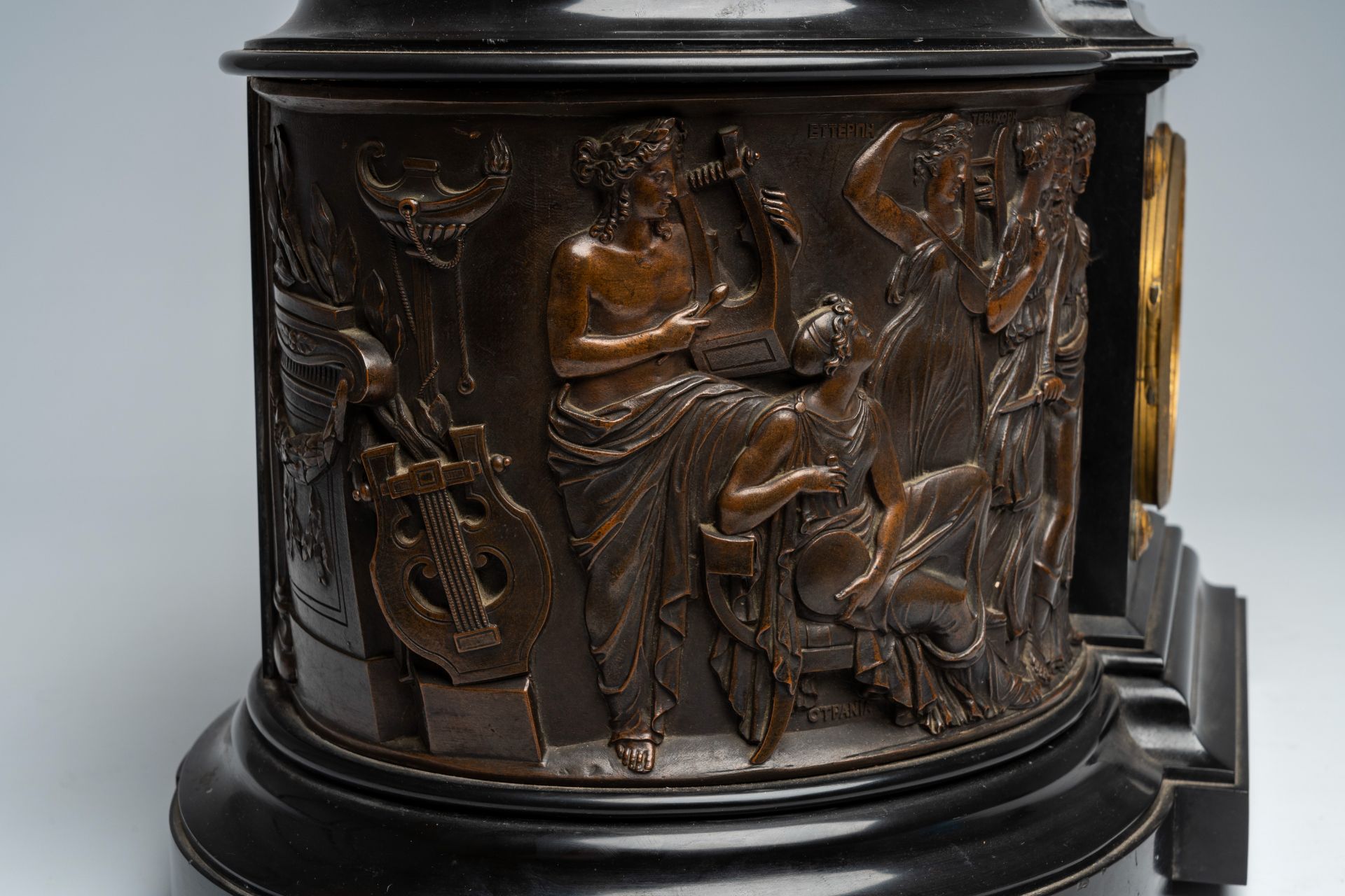 A French black marble mantel clock with a 'Greek goddesses' frieze surmounted by a patinated bronze - Image 7 of 11