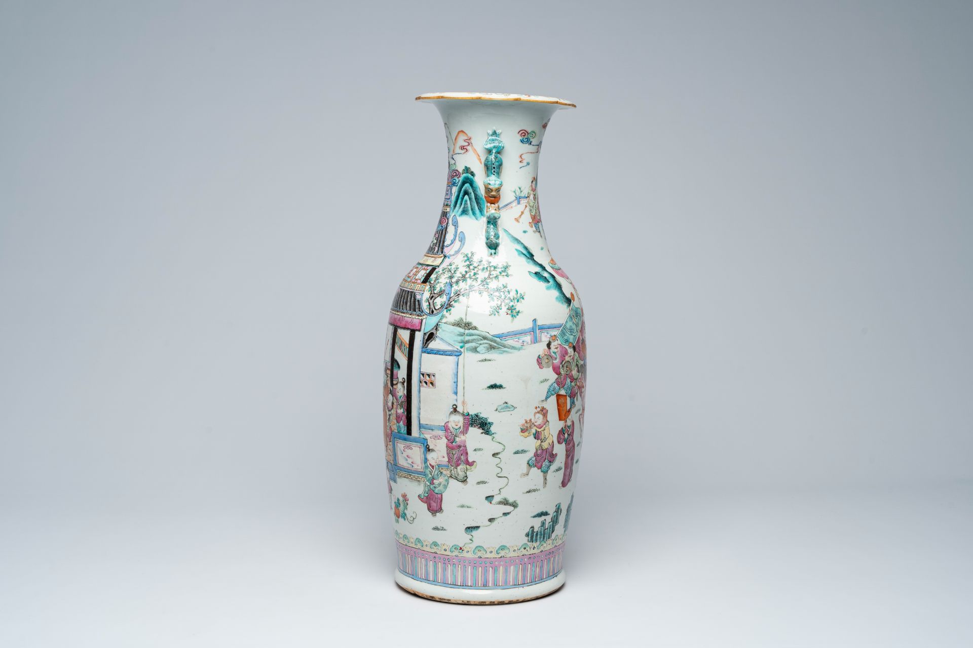 A Chinese famille rose vase with an animated palace scene all around, 19th C.