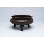 A Chinese bronze tripod 'dragons chasing the pearl' censer, Xuande mark, 20th C.