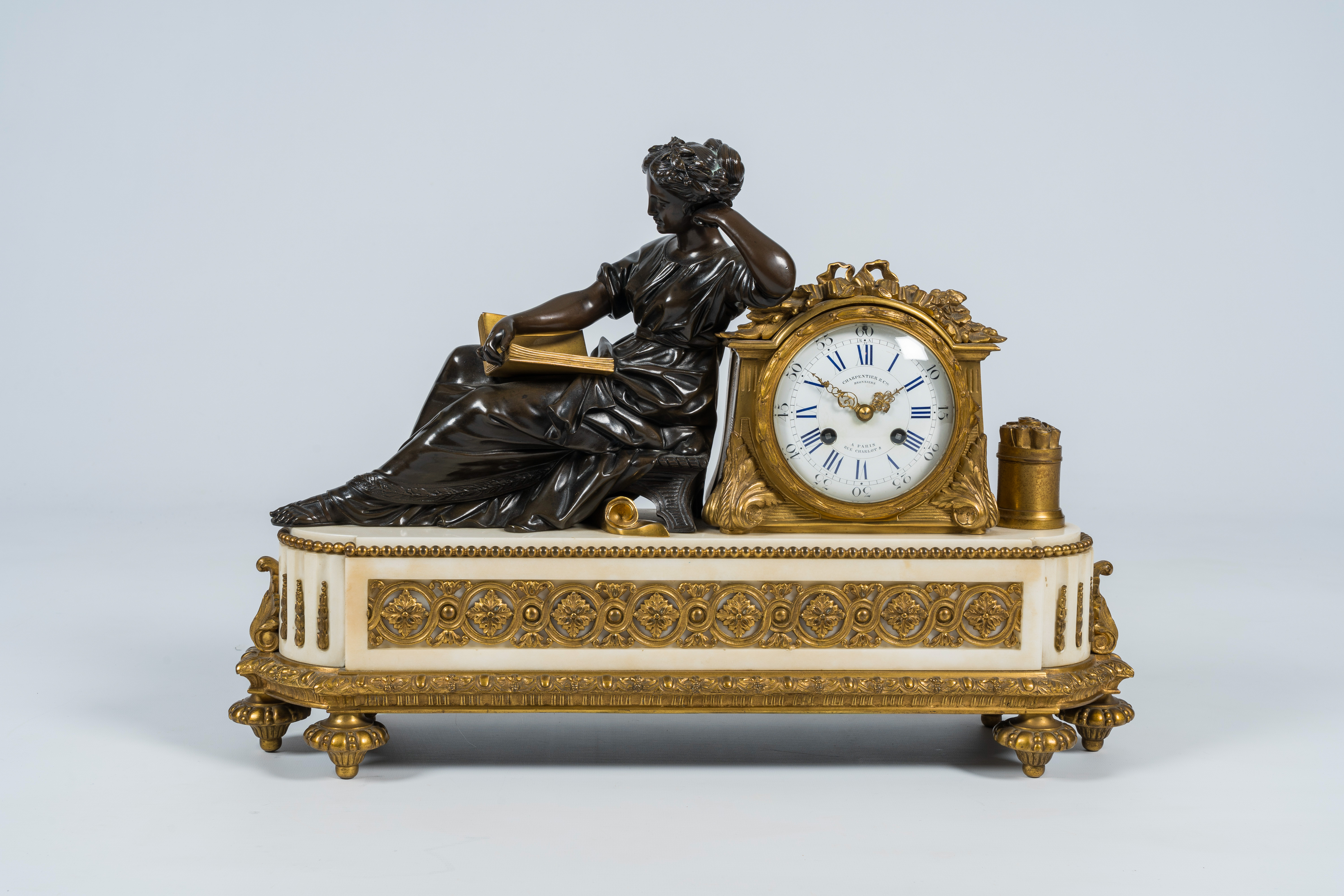 A French gilt bronze mounted white marble mantel clock with a reading lady, Charpentier & Cie, 19th