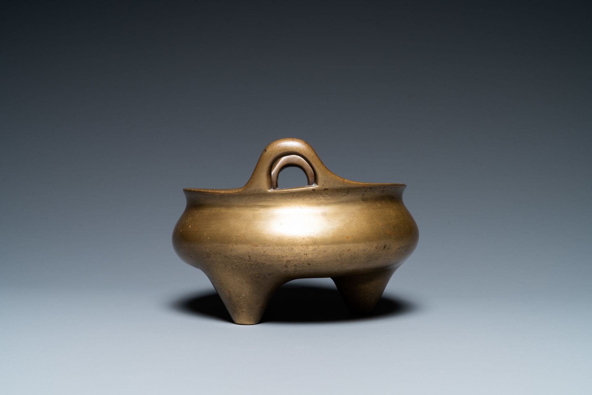 A Chinese bronze tripod censer, Xuande mark, 19th C. - Image 3 of 7