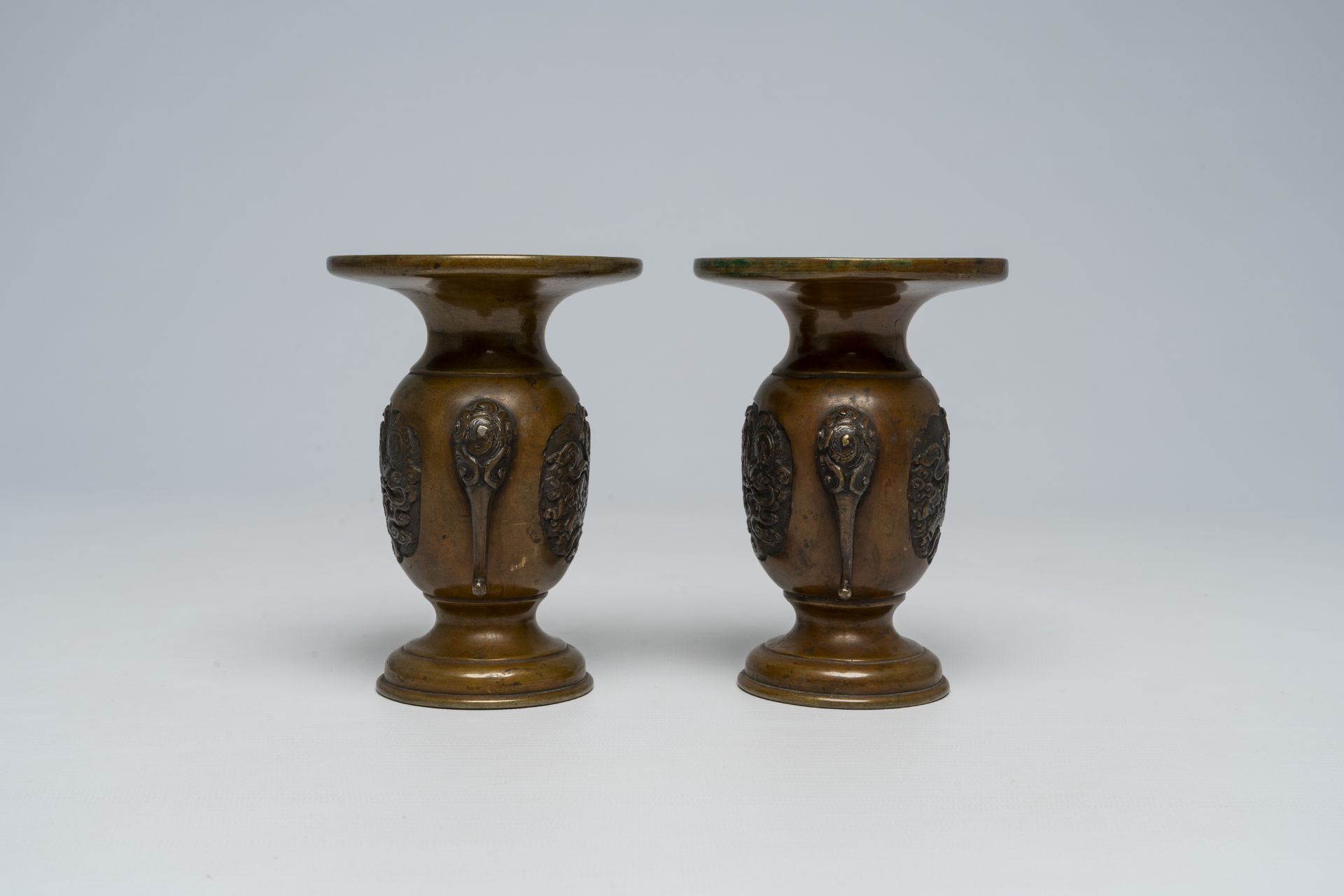 A pair of Japanese bronze vases, two mixed metal chargers with relief design, a blue and white dish - Image 8 of 21