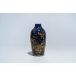 A Chinese powder blue and gilt vase with floral design, Qianlong