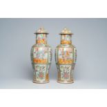 A pair of Chinese Canton famille rose vases and covers with palace scenes and floral design, 19th C.