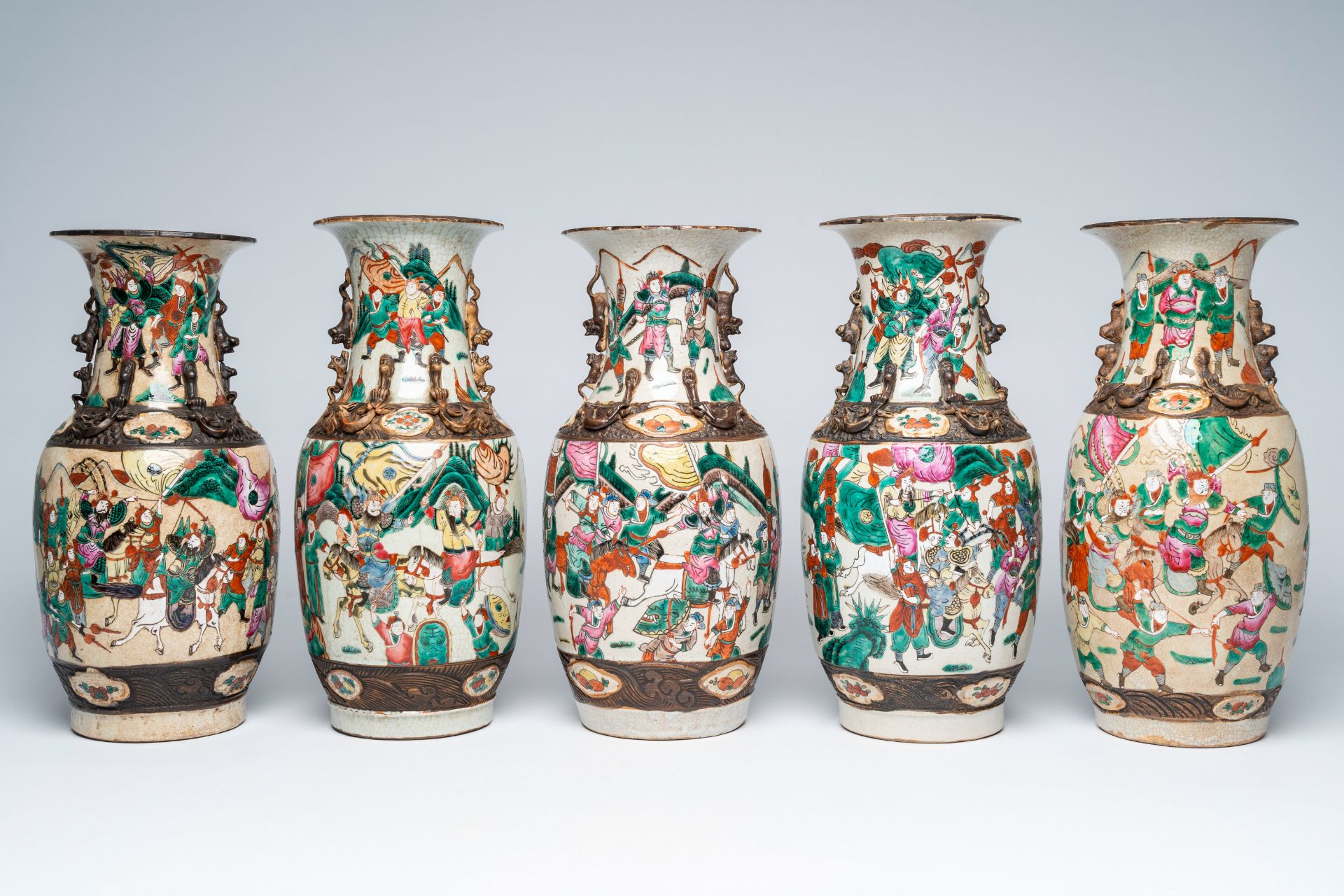 Five Chinese Nanking crackle glazed famille rose 'warrior' vases, 19th/20th C.