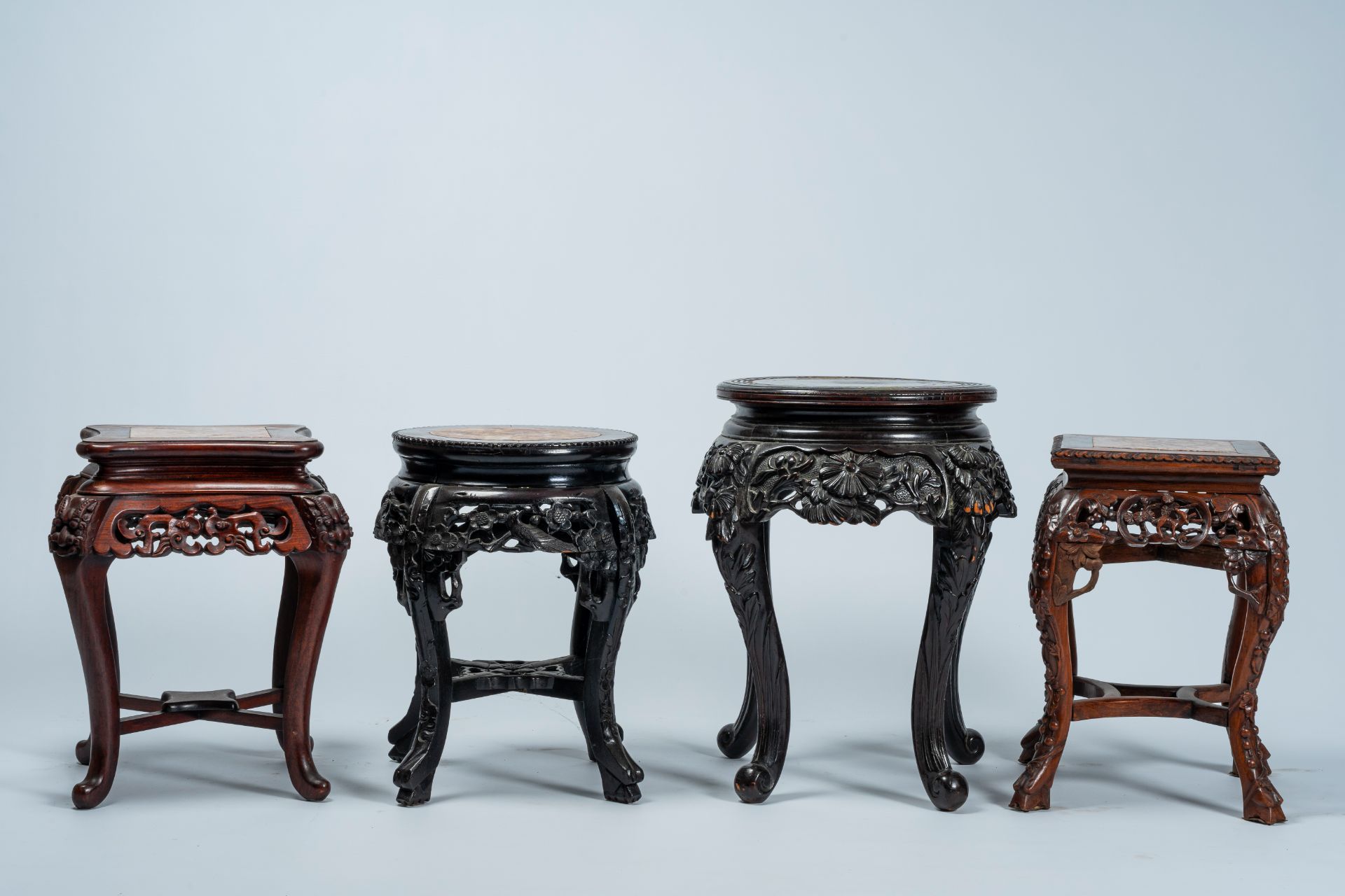 Four Chinese and Japanese open worked carved wood stands with marble and wood top, 20th C. - Image 5 of 7