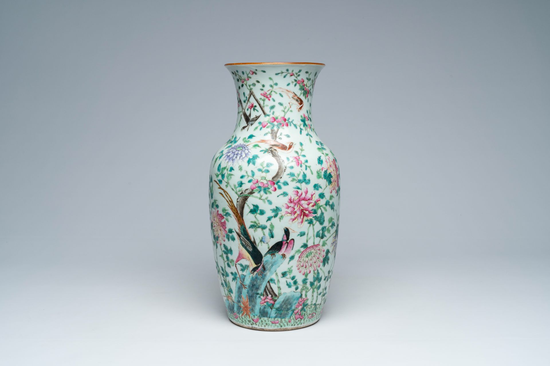 A Chinese famille rose vase with different birds among blossoming branches, 19th C.