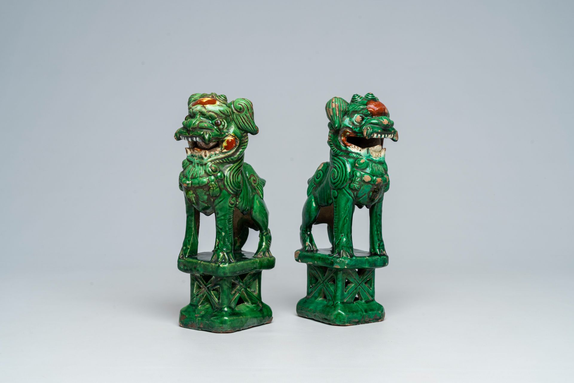 Two Chinese green-glazed earthenware temple lions, 18th/19th C