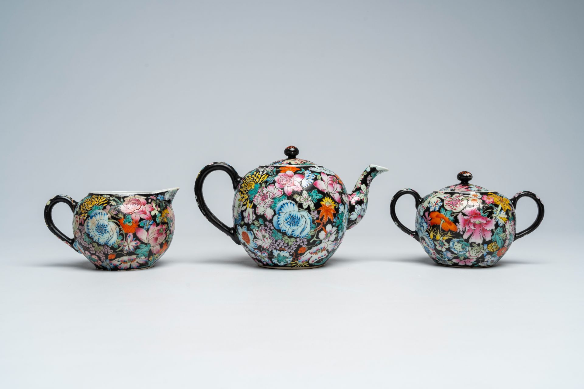 A Chinese fifteen-piece famille rose 'millefleurs' tea set with matching case, Guangxu mark, 20th C. - Image 8 of 20