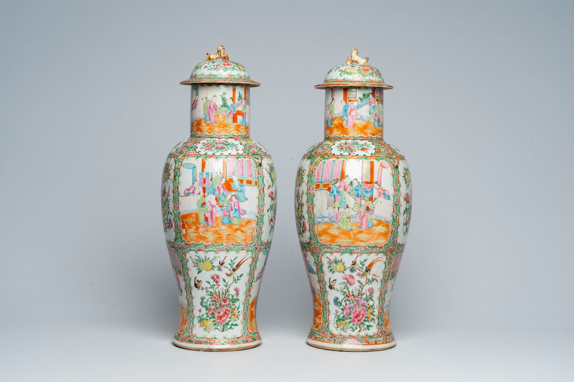 A pair of Chinese Canton famille rose vases and covers with palace scenes and floral design, 19th C. - Image 3 of 6