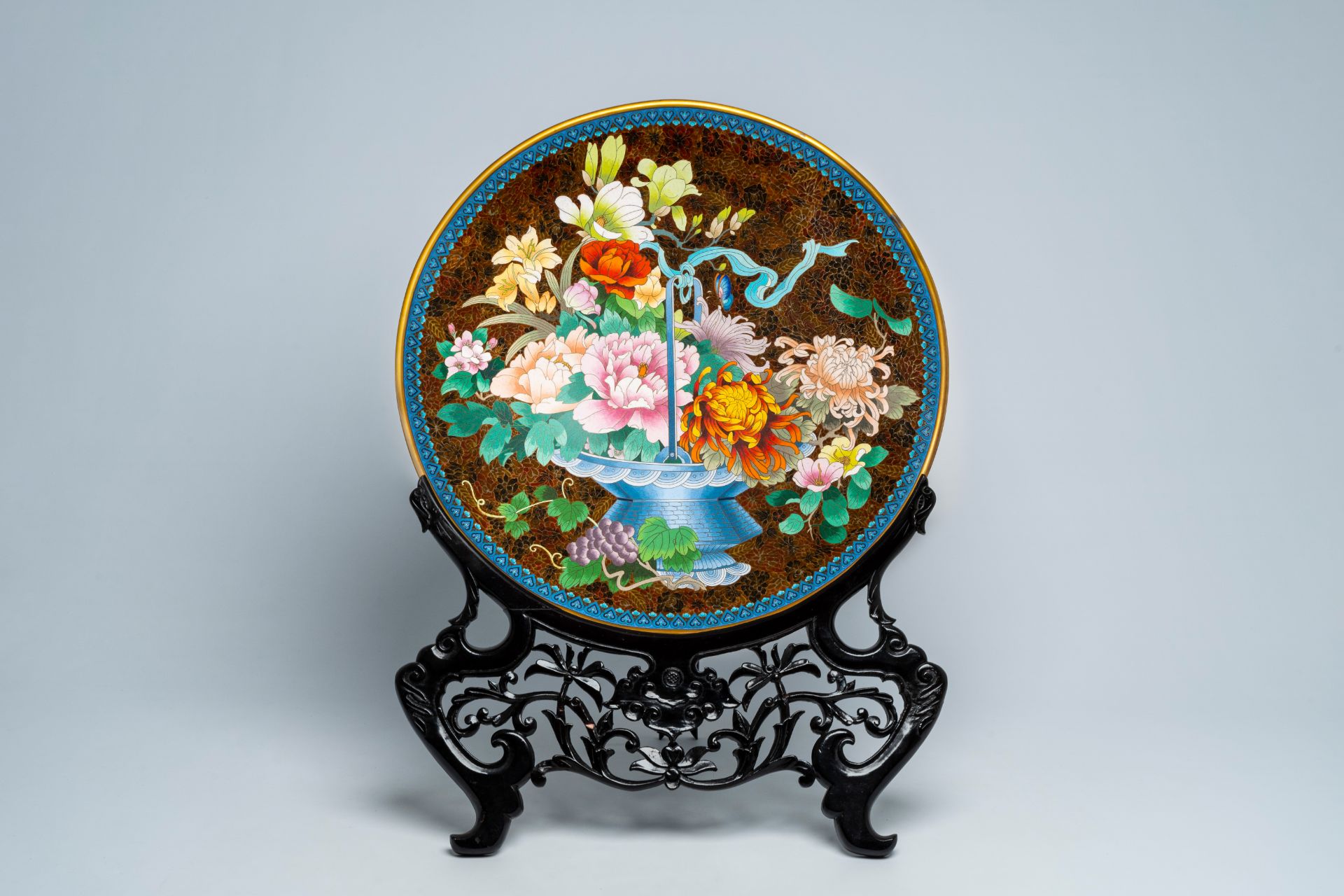 An impressive Chinese cloisonnÃ© 'flower basket' charger, 20th C.