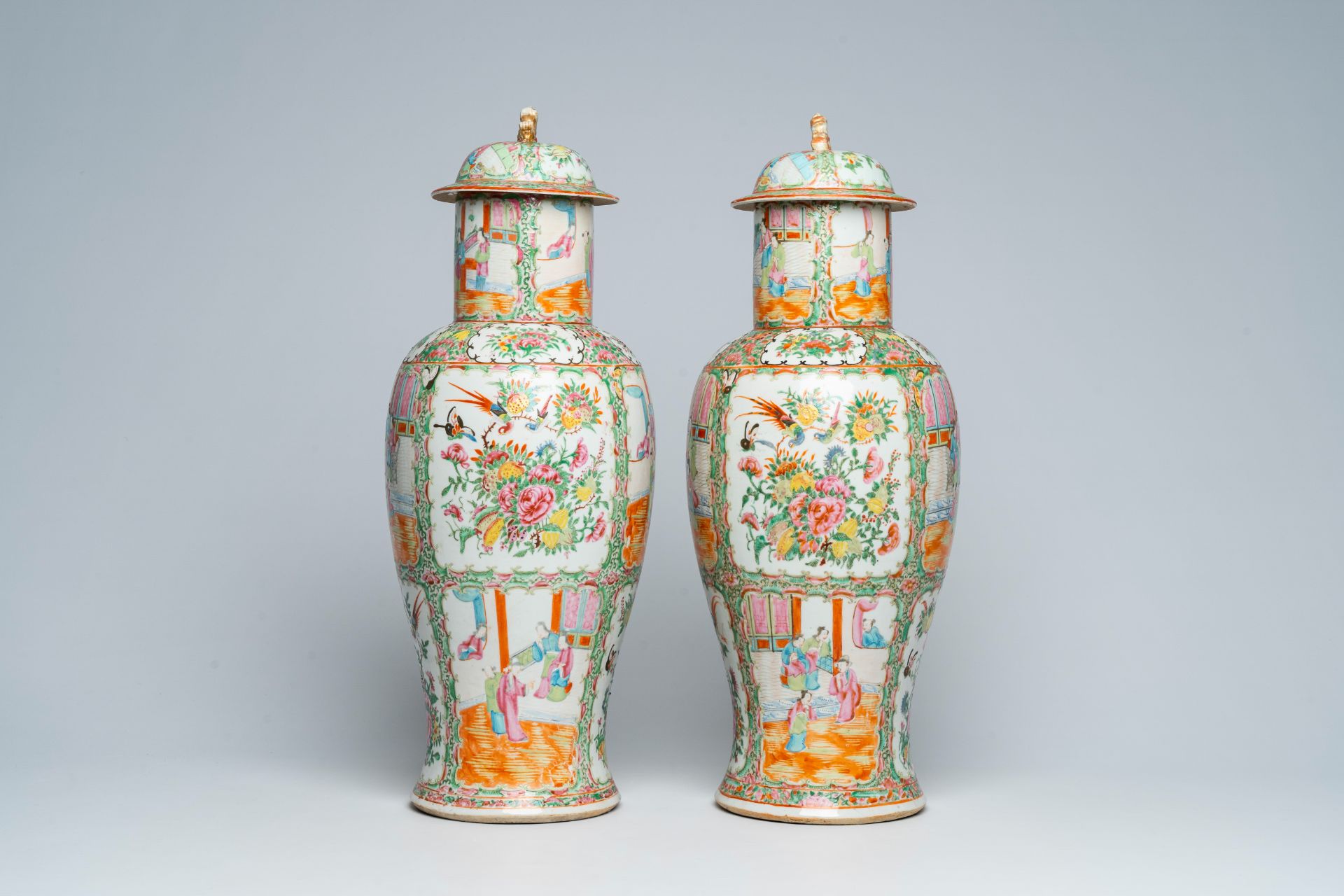 A pair of Chinese Canton famille rose vases and covers with palace scenes and floral design, 19th C. - Image 2 of 6