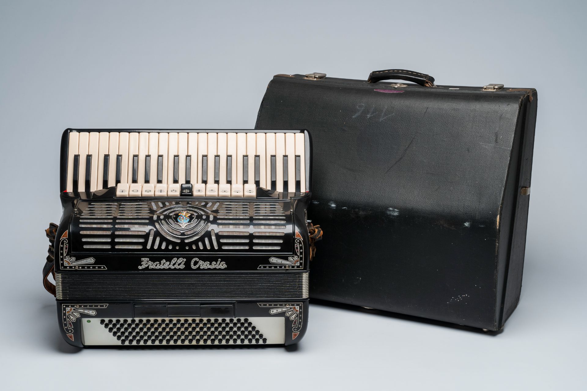 An Italian 'Fratelli Crosio' chromatic accordion with piano keyboard and box, ca. 1950/60