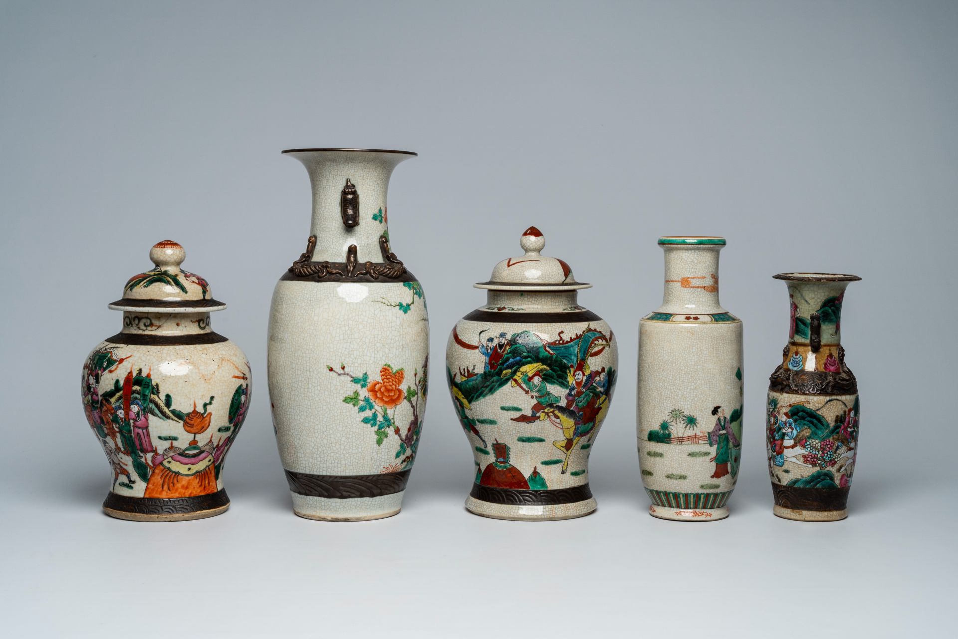 A varied collection of Chinese Nanking crackle glazed famille rose and verte vases and jars with war - Image 5 of 13