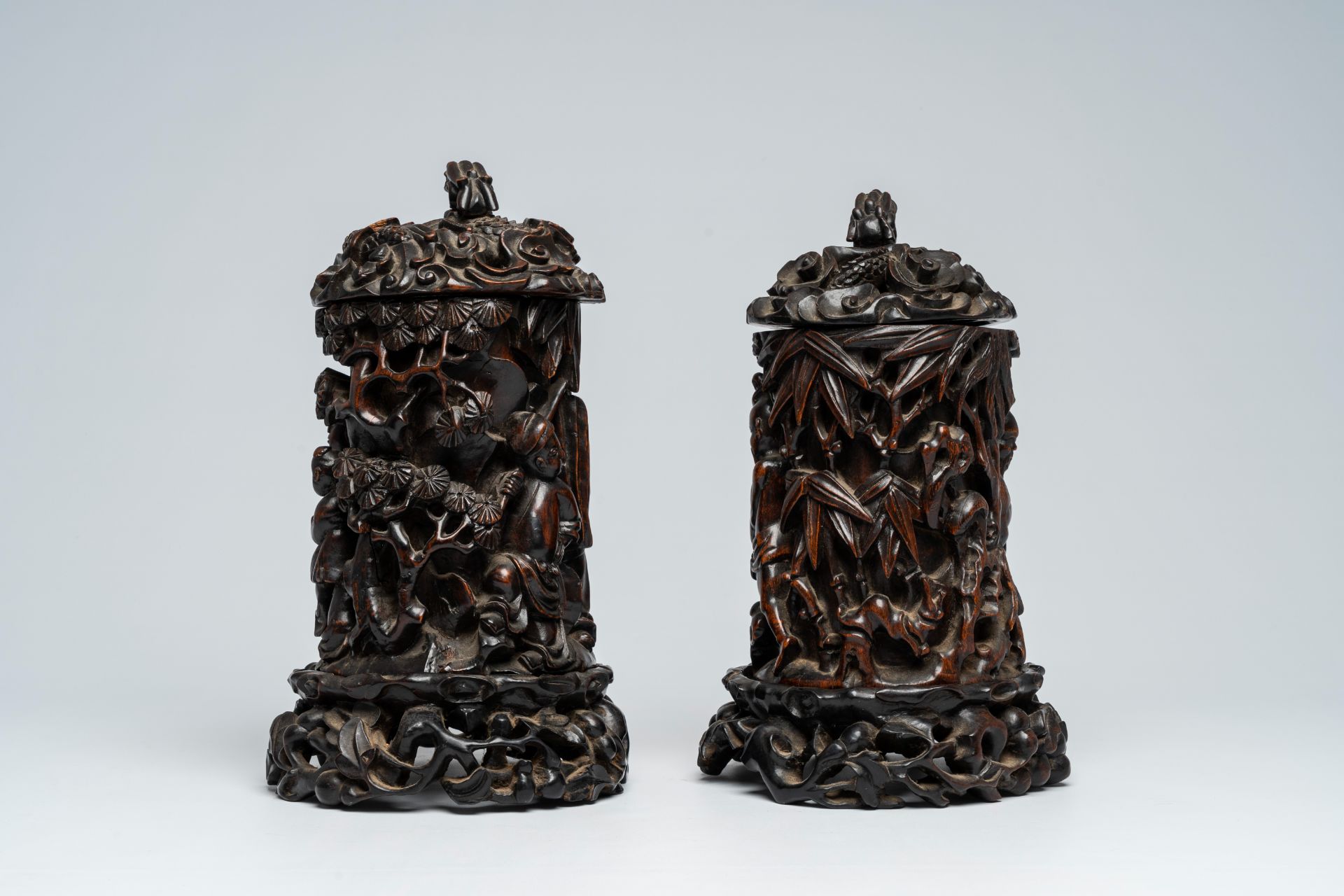 A pair of Chinese wood brush pots with relief design and a pair of open worked stands and covers, 19 - Image 2 of 7