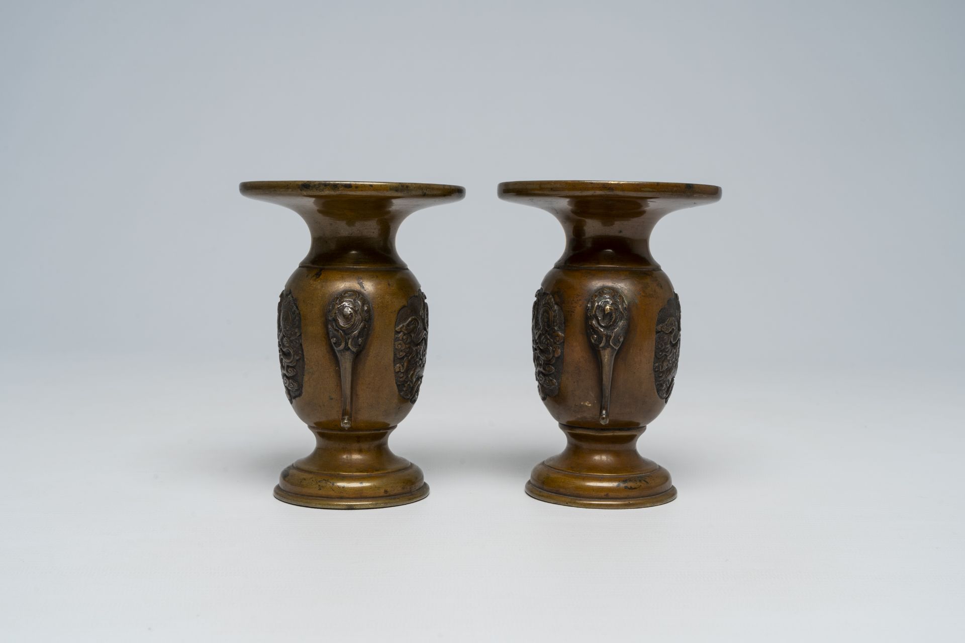 A pair of Japanese bronze vases, two mixed metal chargers with relief design, a blue and white dish - Image 6 of 21