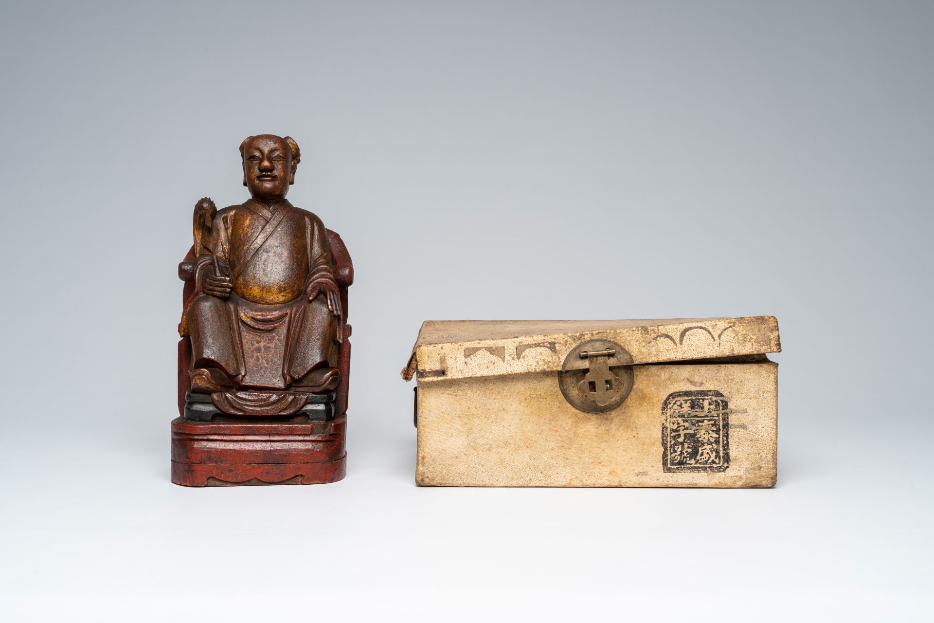 A Chinese polychrome wood sculpture, a collection of printing stamps and a travel case, 19th/20th C. - Image 6 of 11