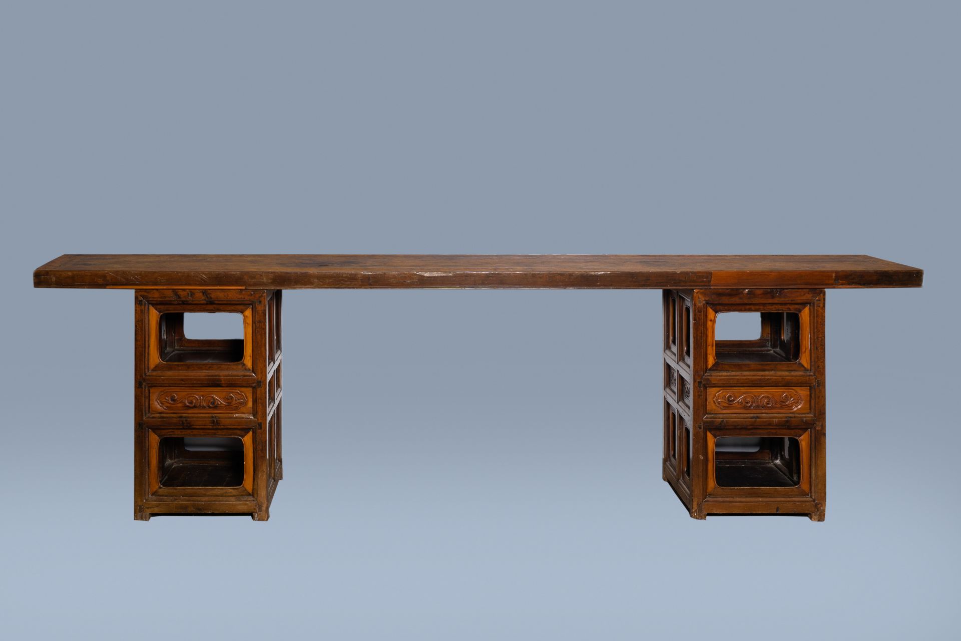 A long Chinese wood console table, 20th C.