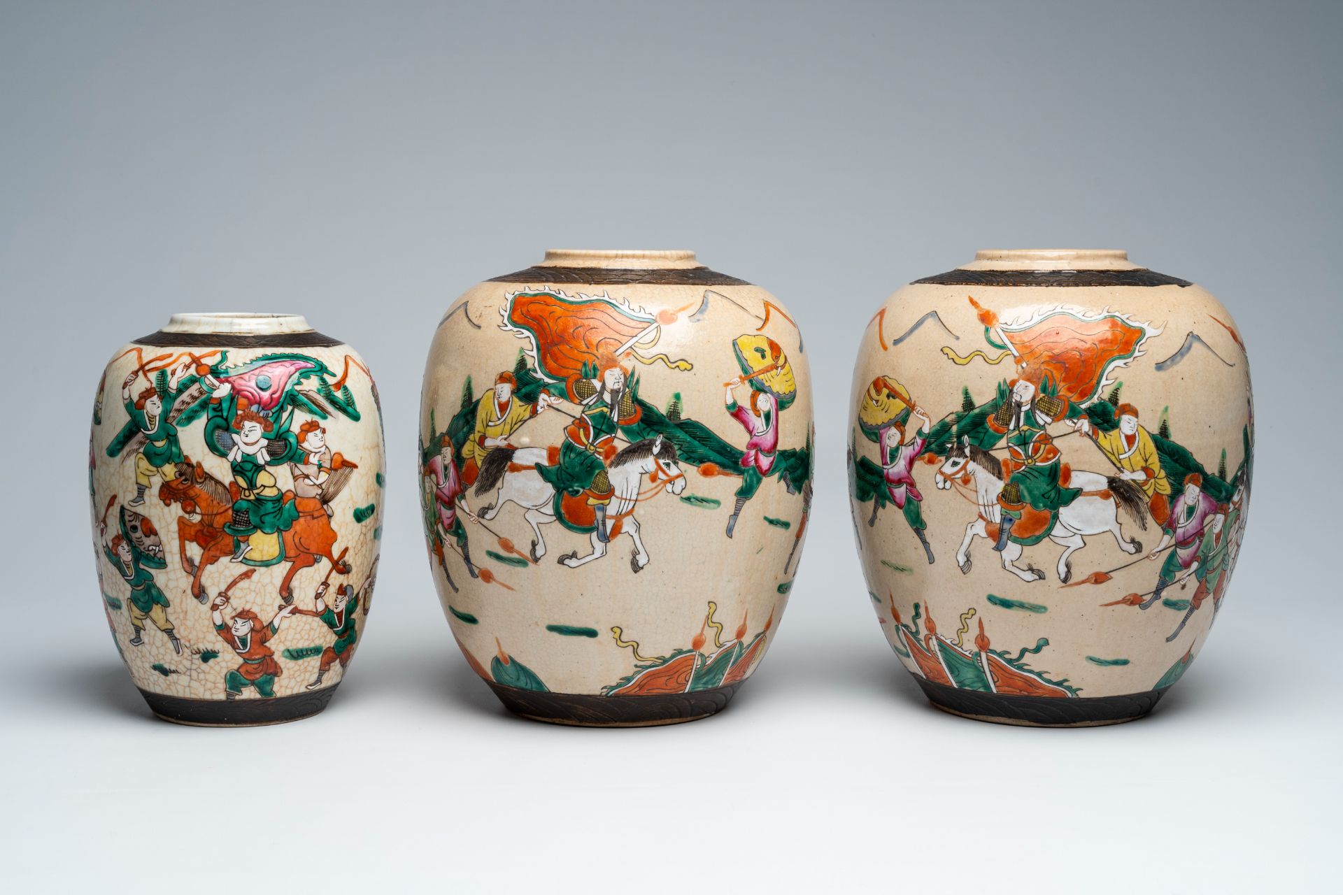 Three Chinese Nanking crackle glazed famille rose 'warrior' ginger jars, 19th C.