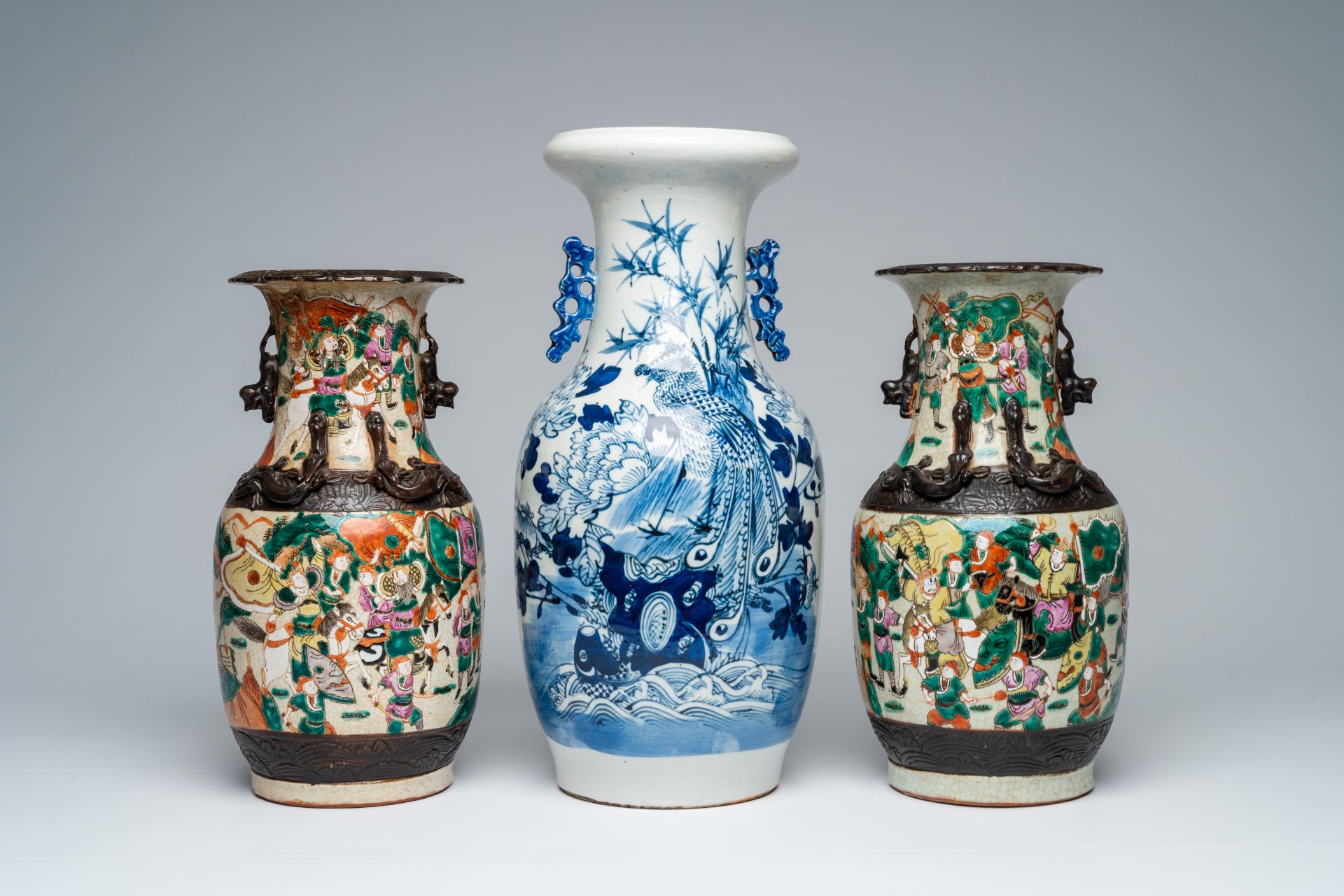 A pair of Chinese Nanking crackle glazed famille rose 'warrior' vases and a blue and white 'phoenix' - Image 2 of 7