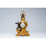 A French gilt and patinated bronze mantel clock with a winged dragon and a putto, 19th C.