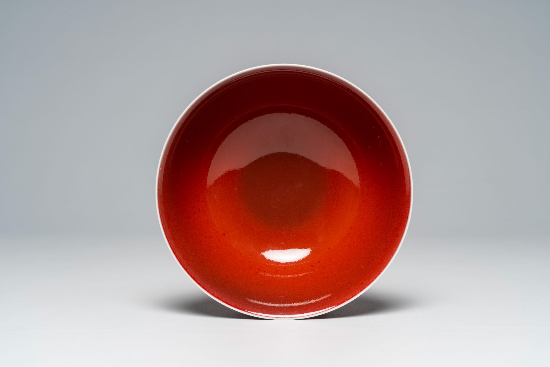 A Chinese monochrome liver red bowl, Qianlong mark, 19th/20th C. - Image 6 of 7