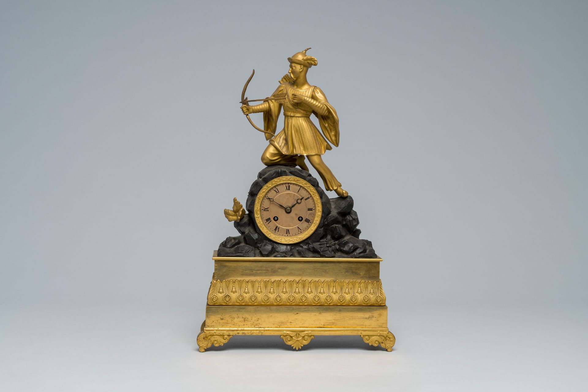 A French gilt and patinated bronze mantel clock topped with a Moorish archer, 19th C.