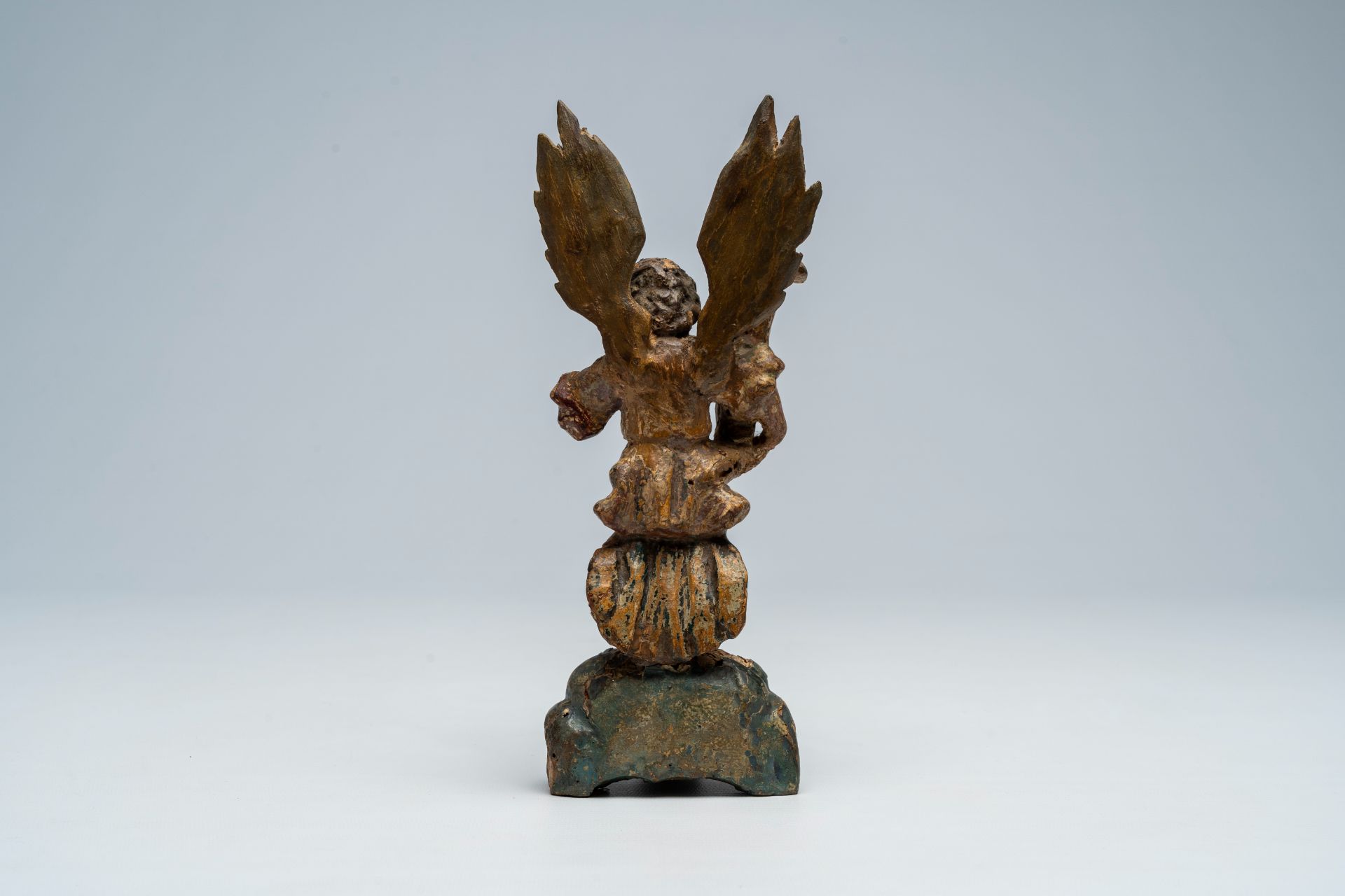 An Italian carved, polychrome painted and gilt wood archangel Michael shaped candlestick, 17th C. - Image 4 of 9