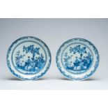 A pair of Chinese blue and white dishes with figures in a garden, Qianlong