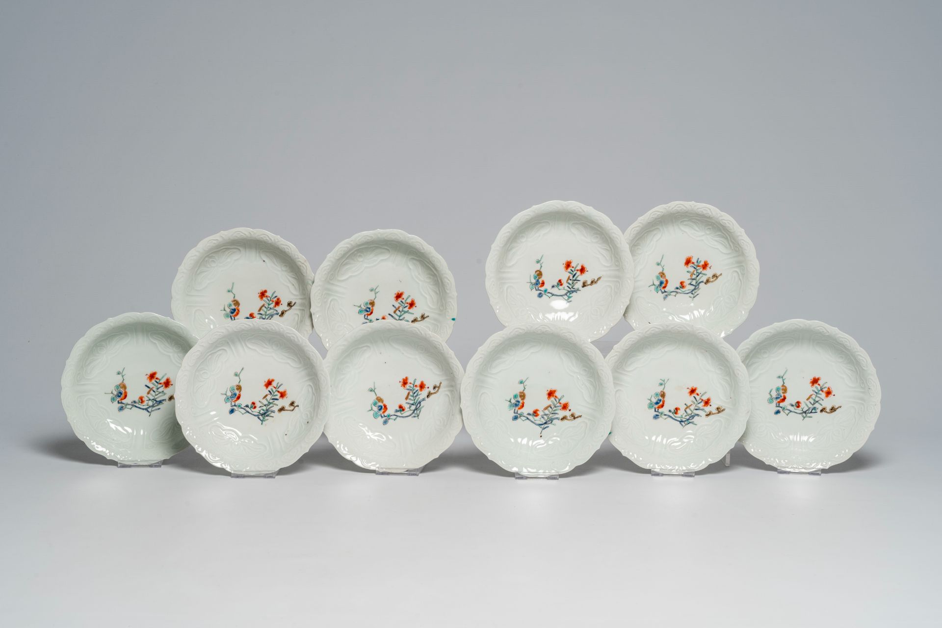 Ten Japanese moulded Kakiemon style bowls with floral design, Edo/Meiji, 18th/19th C.