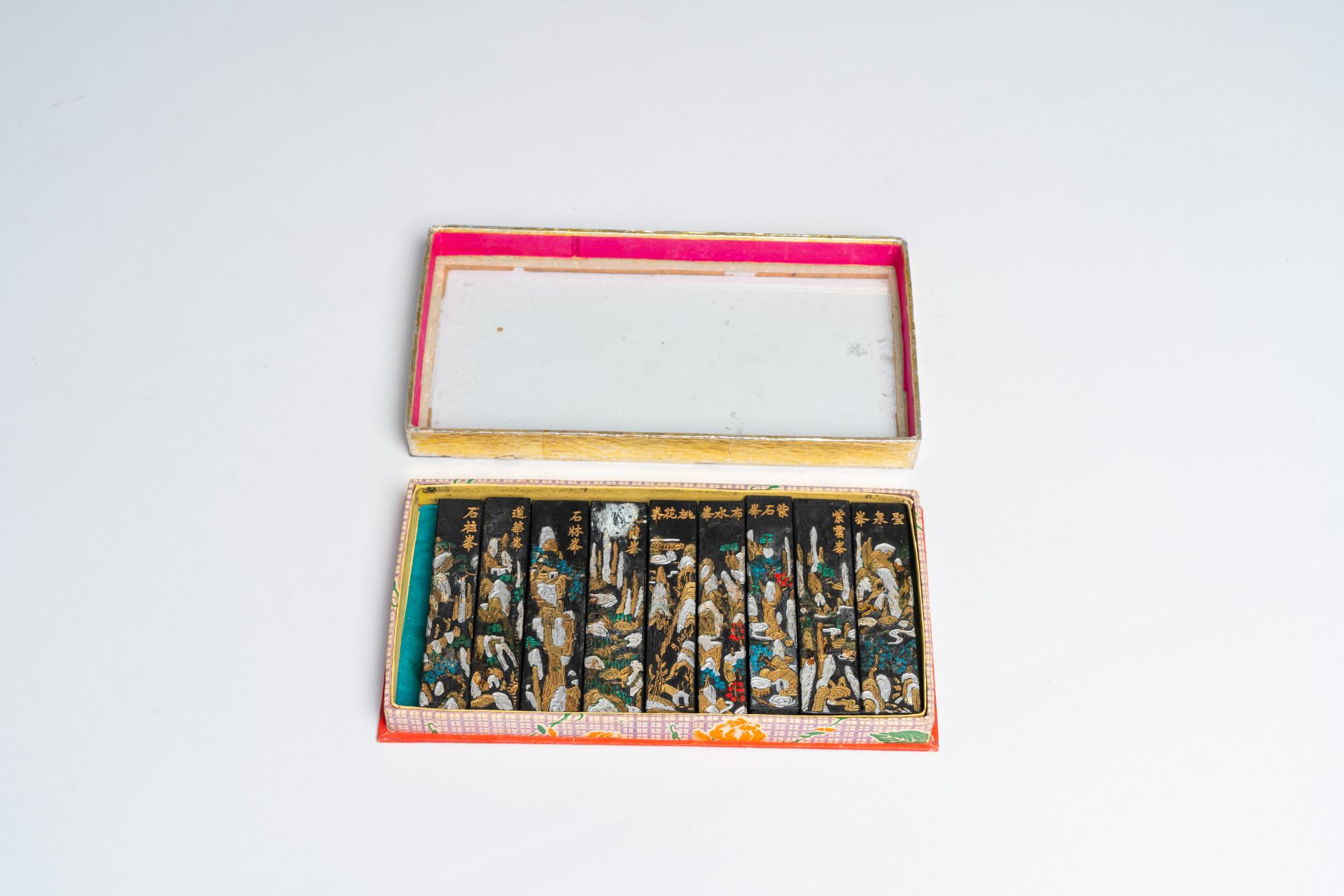 A Chinese polychrome wood sculpture, a collection of printing stamps and a travel case, 19th/20th C. - Image 5 of 11