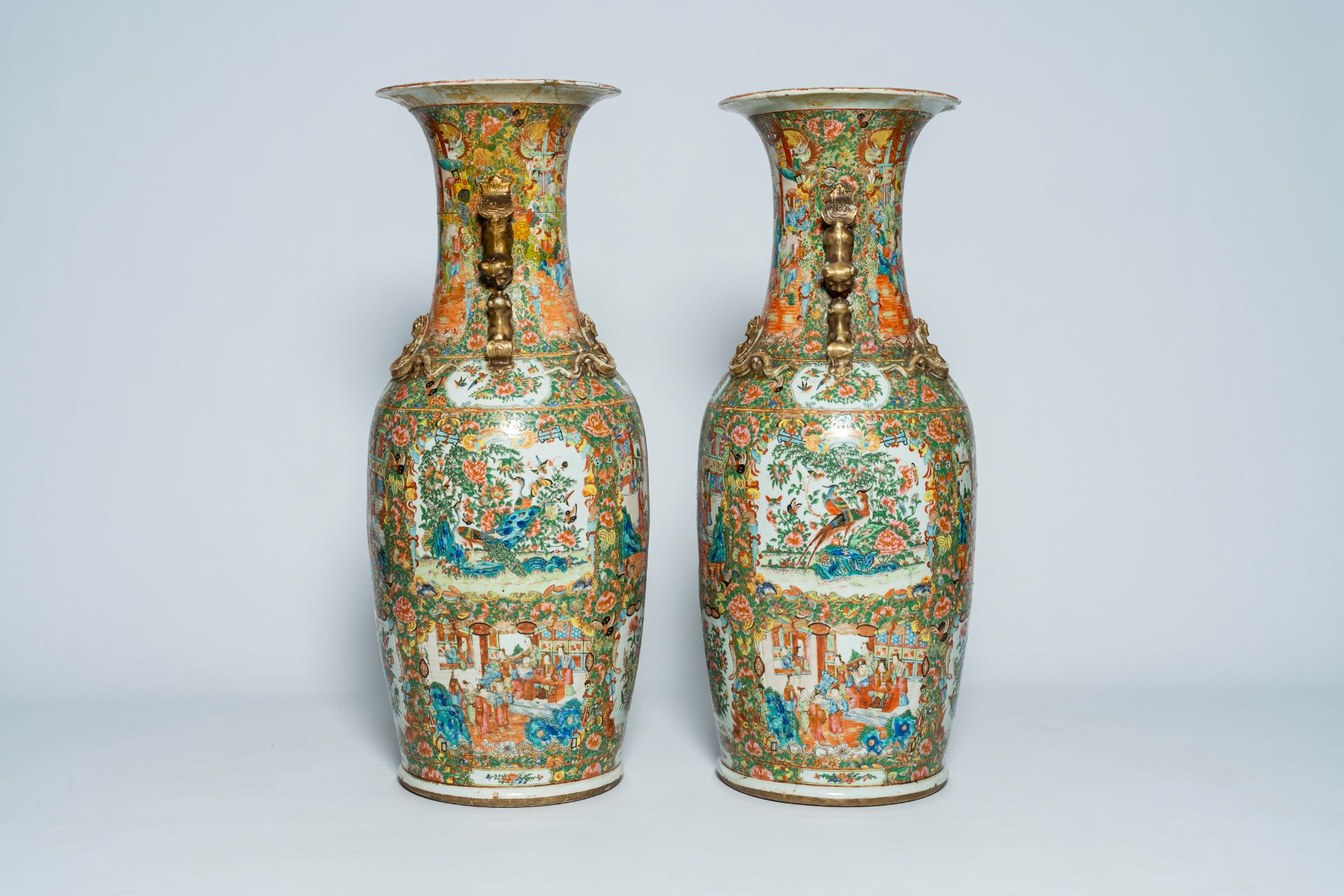 A pair of large Chinese Canton famille rose vases with palace scenes and floral design, 19th C. - Image 2 of 6