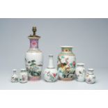 Seven various Chinese famille rose vases, one of which mounted as a lamp, 20th C.