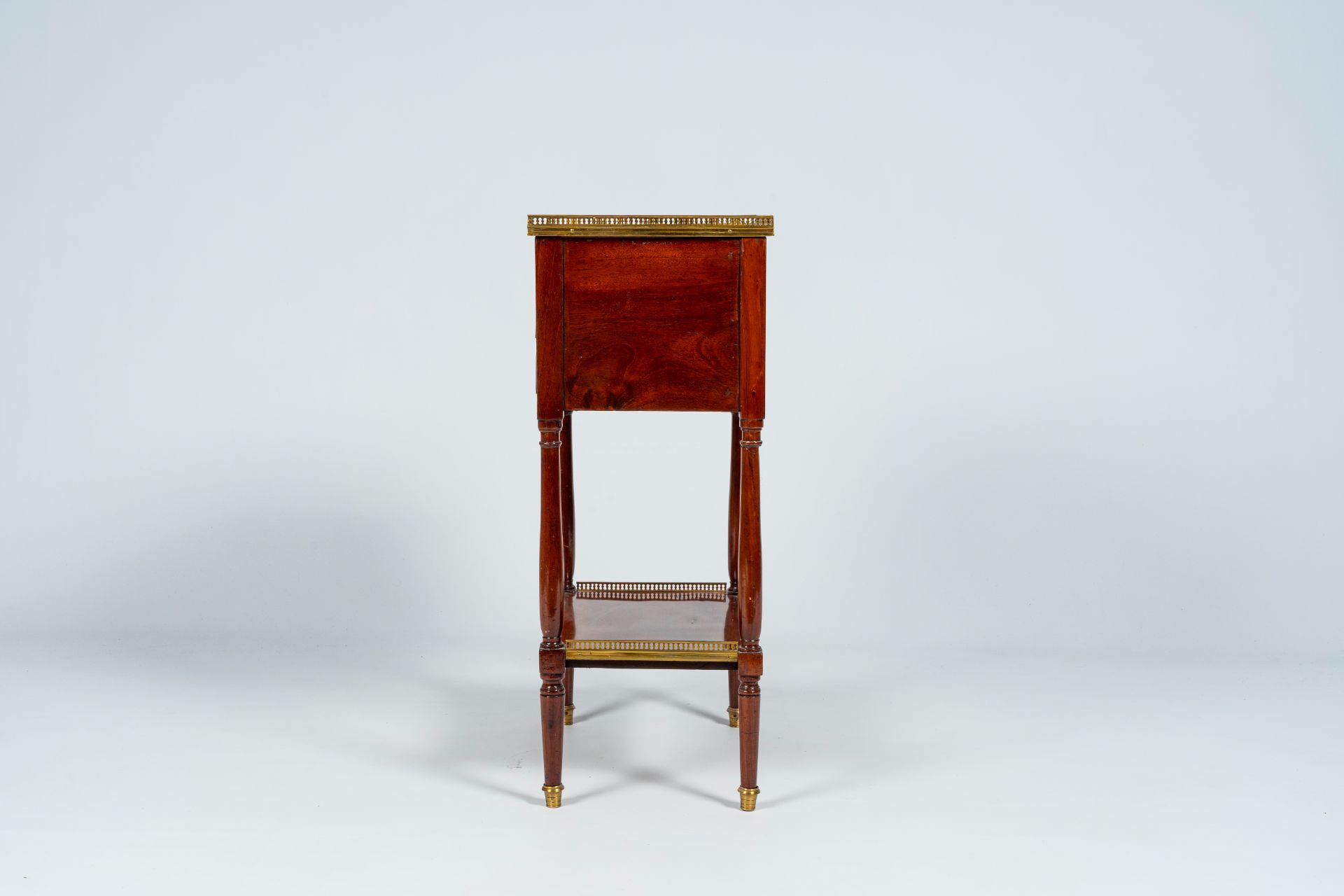 A French mahogany gilt brass mounted side table with three drawers, late 19th C. - Image 4 of 8