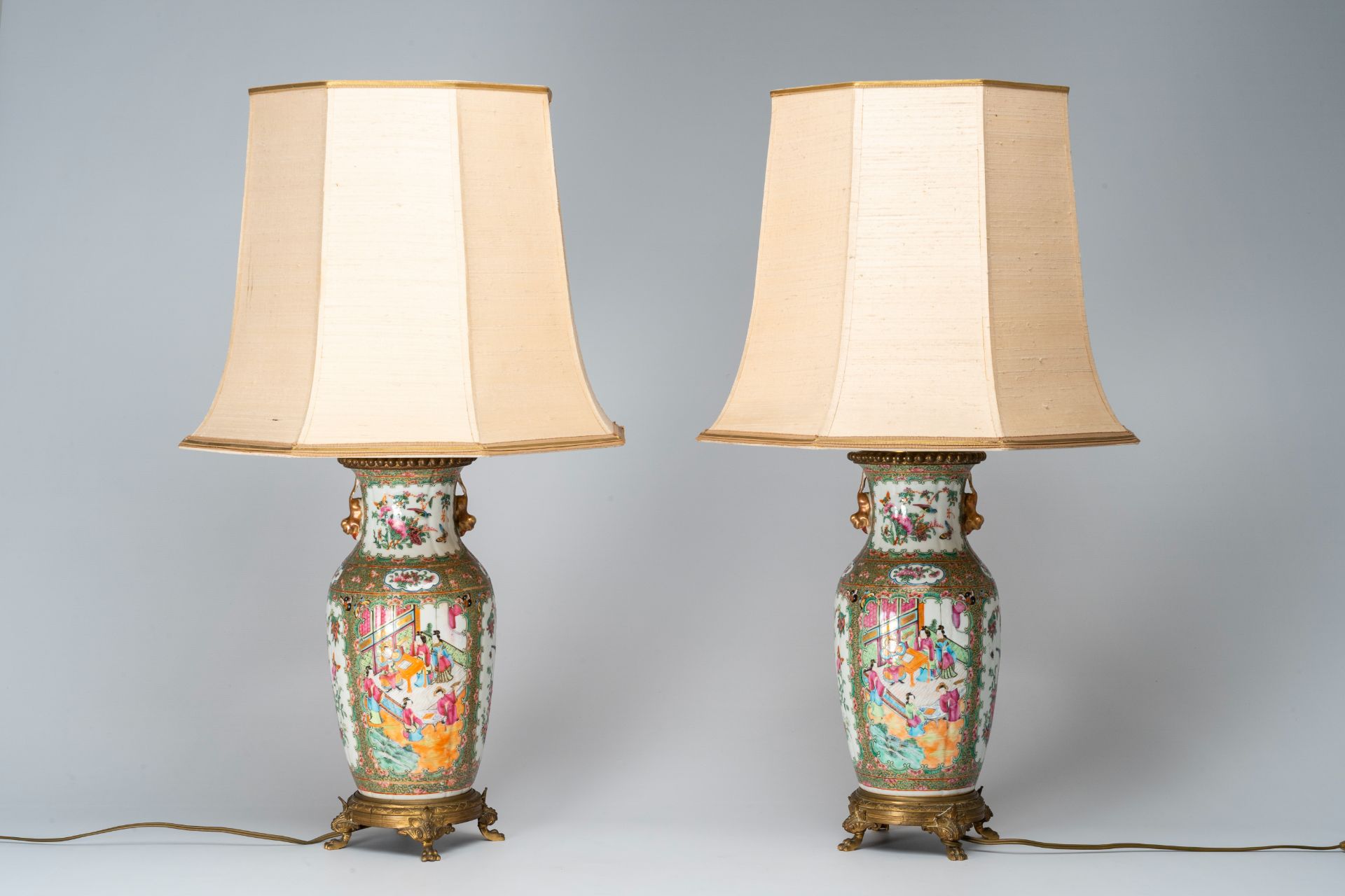 A pair of Chinese Canton famille rose vases with palace scenes mounted as lamps, 19th C. - Image 2 of 7