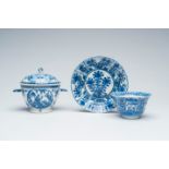 A Chinese blue and white Ã©cuelle with shell handles and a cup and saucer with floral design, 18th/1
