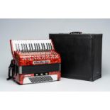 A Czech 'Delicia' chromatic accordion with piano keyboard and box, ca. 1990
