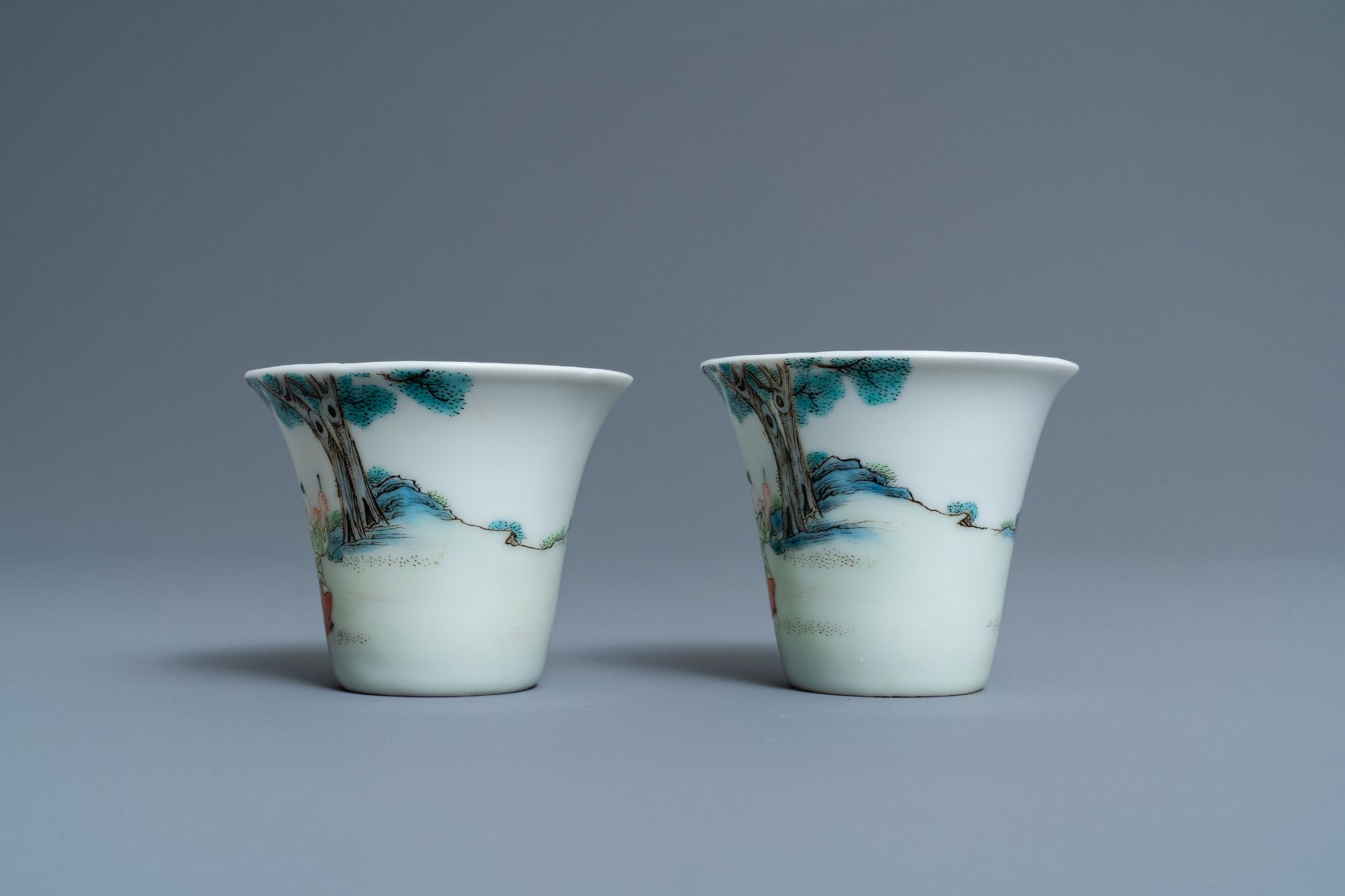 A pair of Chinese famille rose 'playing boys' wine cups, Qianlong mark, Republic, 20th C. - Image 4 of 7