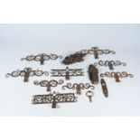 A varied collection of cast iron locks and hinges, 19th C.