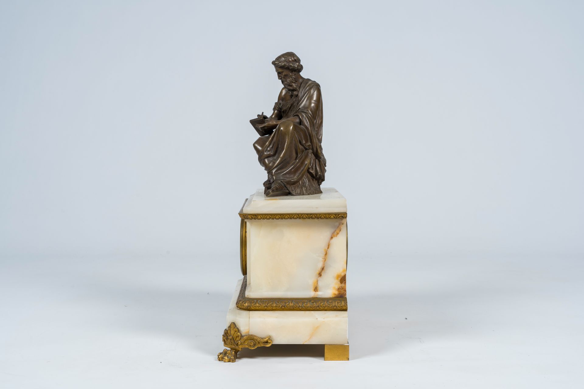 A French gilt and patinated bronze mounted white onyx mantel clock with a legist, 19th C. - Image 3 of 10