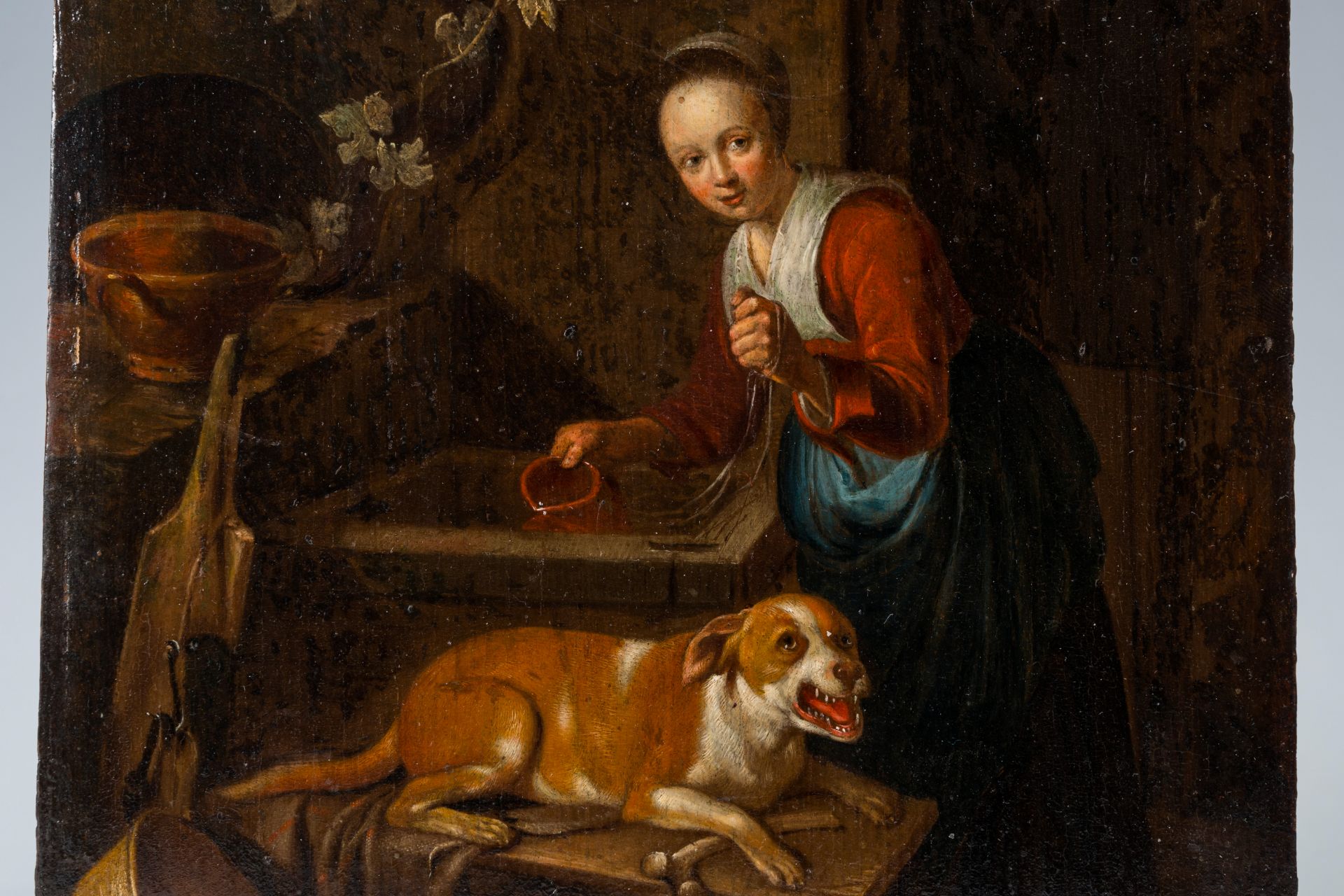 Dutch school: Kitchen maid with her dog at the well, oil on panel, 17th C. - Image 4 of 4
