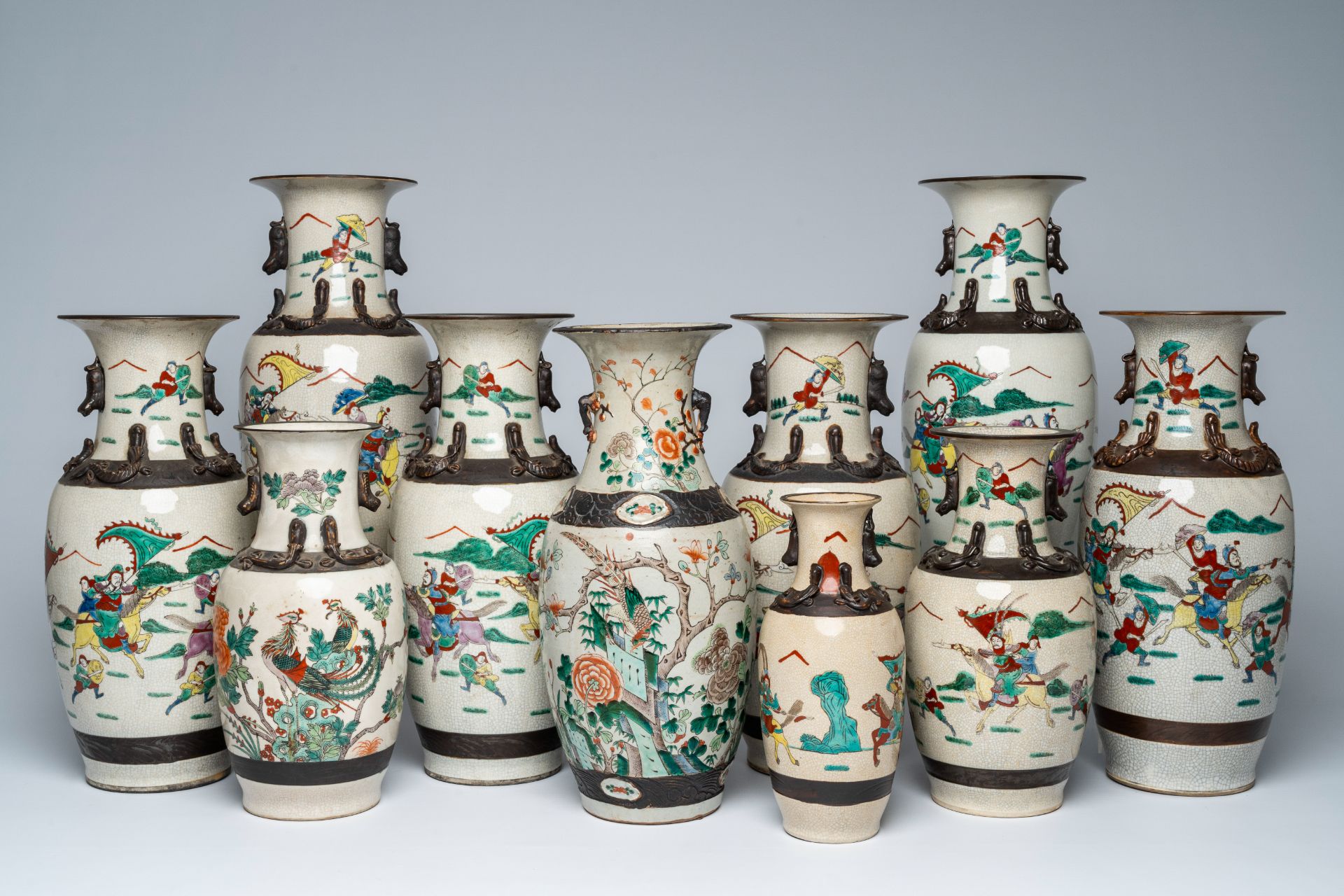 A varied collection of ten Chinese Nanking crackle glazed famille verte vases with warrior scenes an