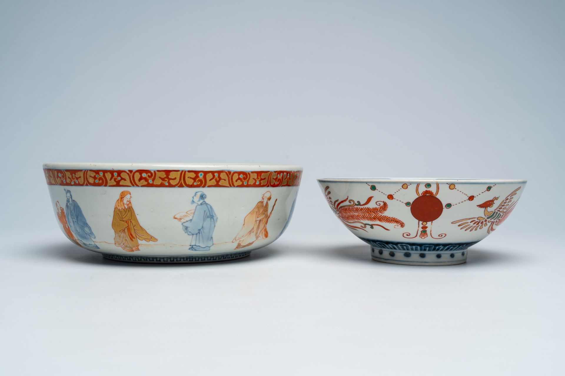 A Japanese Imari 'sages' bowl and a bowl with sailing ships and phoenixes, Meiji, 19th C. - Image 7 of 7